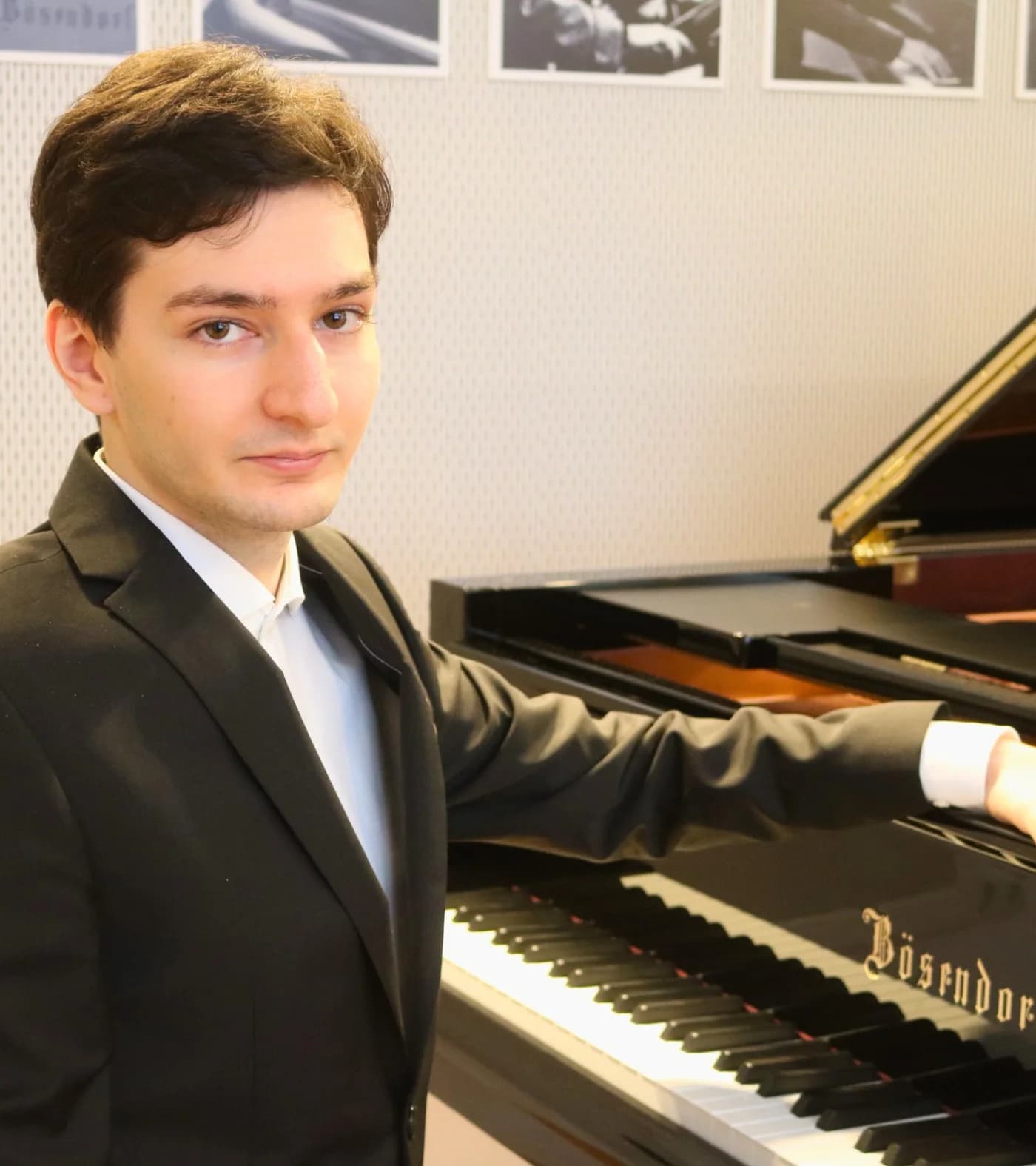 Enea seated at the piano