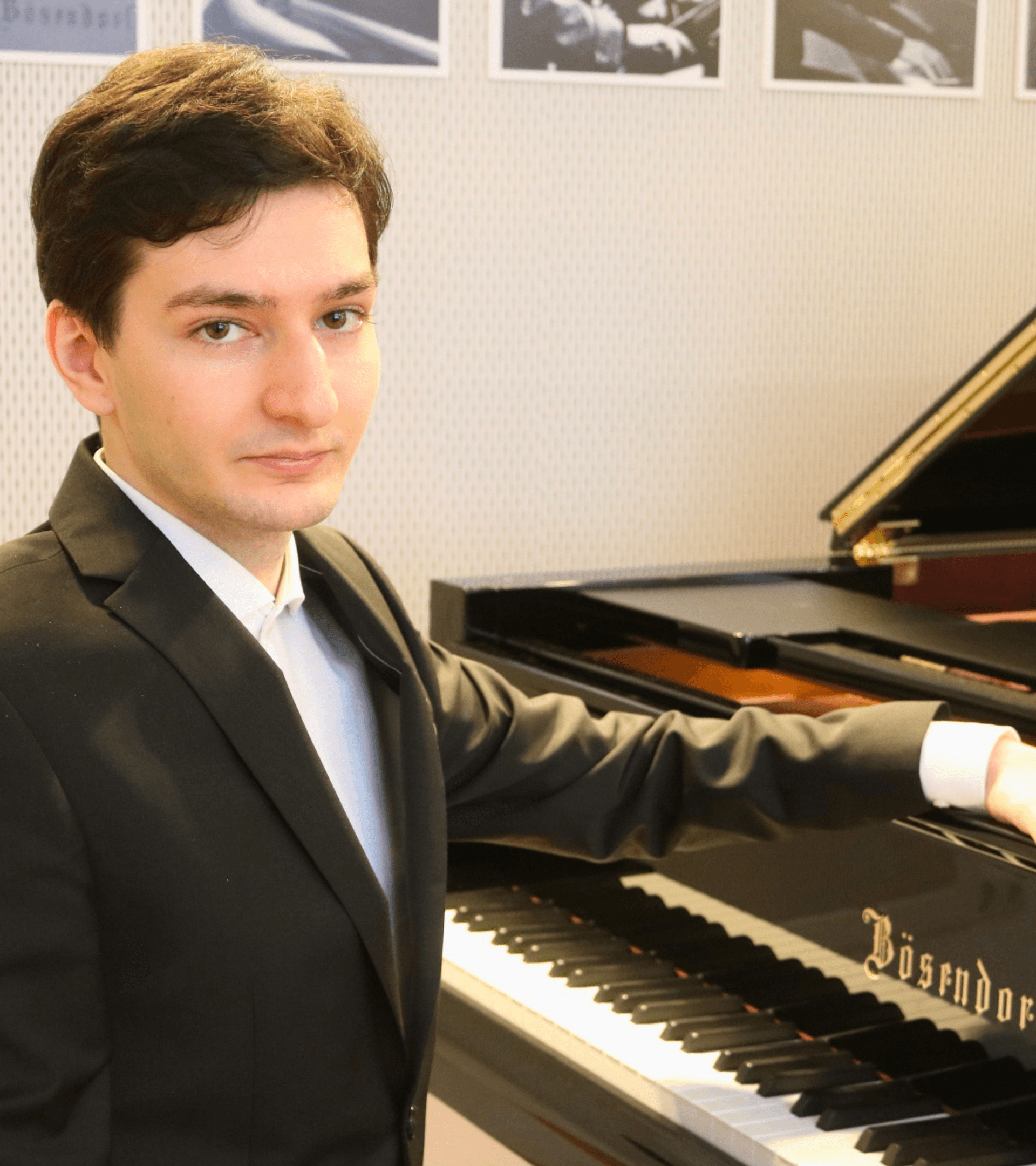Enea seated at the piano