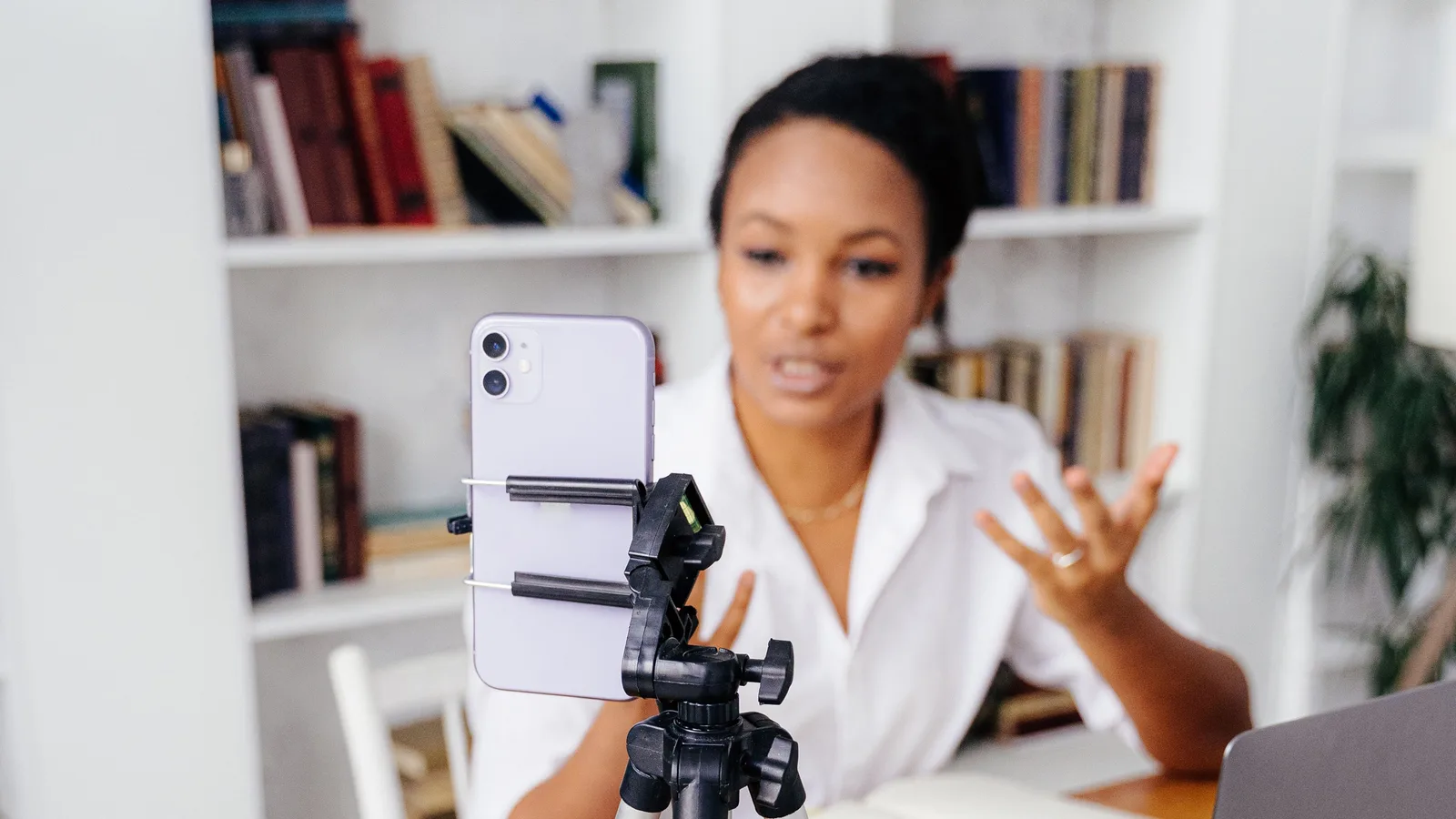 A smartphone secured on a stand during a video conversation